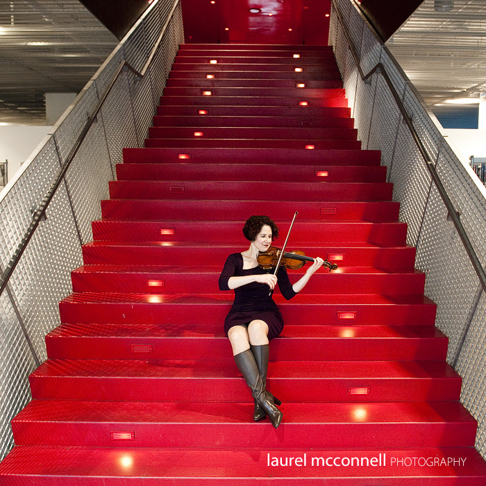 Seattle Symphony violinist Elisa Barston plays for us at the Seattle Libary during her portrait on the stairs