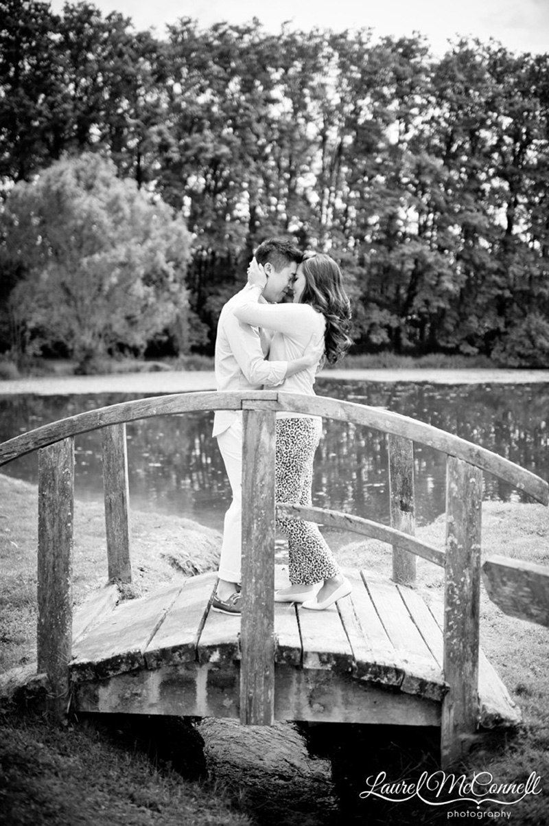 Bride and groom embracing during engagement session at Washington winery .